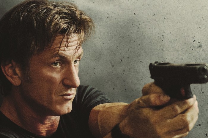 Sean Penn holding a handgun