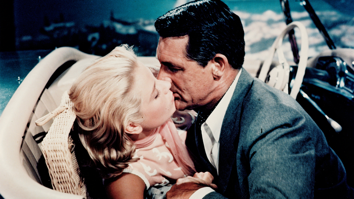 Grace Kelly kissing Cary Grant