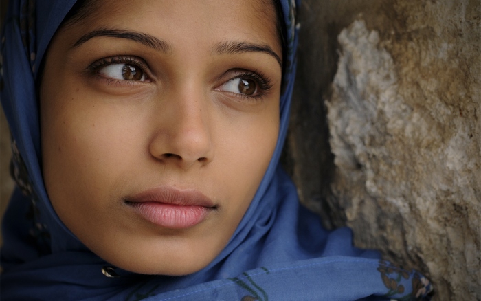 Freida Pinto wearing a blue headscarf
