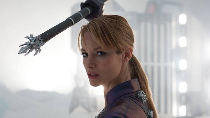 Sienna Guillory holding a weapon