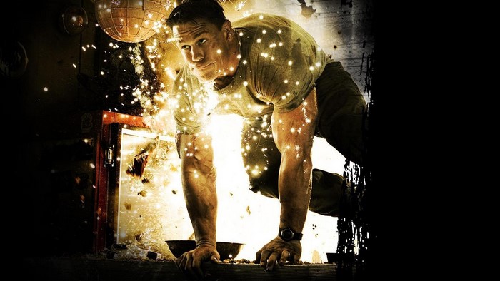 John Cena in a dimly lit room with explosions