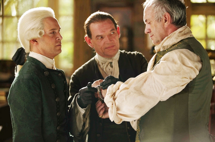 Jonathan Pryce and two men in historical attire