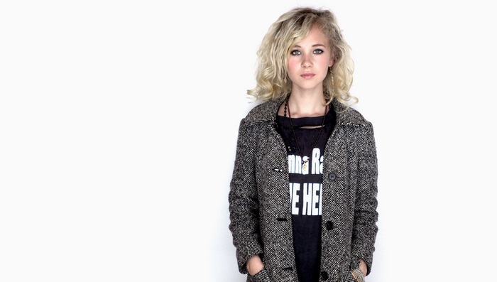 Juno Temple wearing a coat and t-shirt