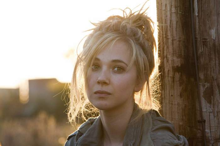Juno Temple in a jacket outdoors