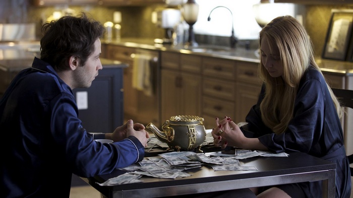 Juno Temple in a kitchen with money