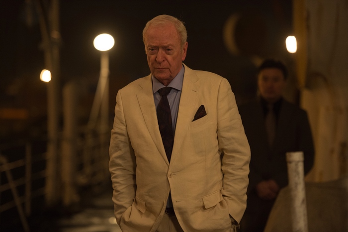 Michael Caine in a suit at night