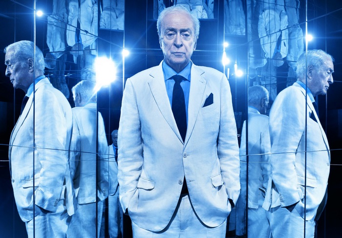 Michael Caine in a mirrored room