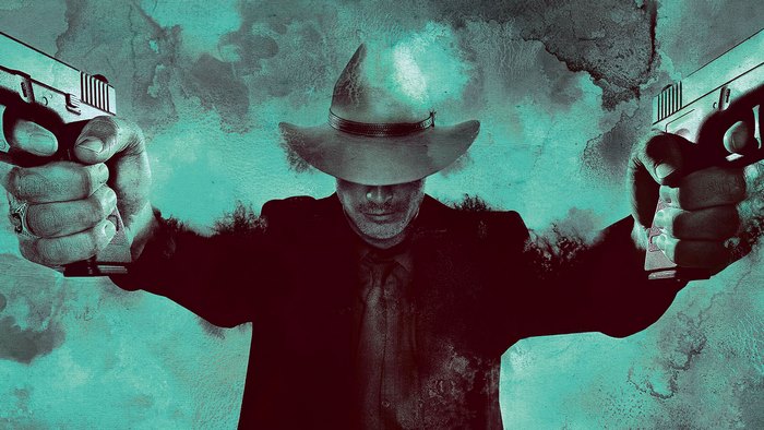 Timothy Olyphant with two guns