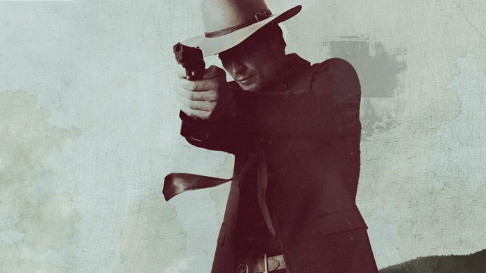 Timothy Olyphant aiming a pistol