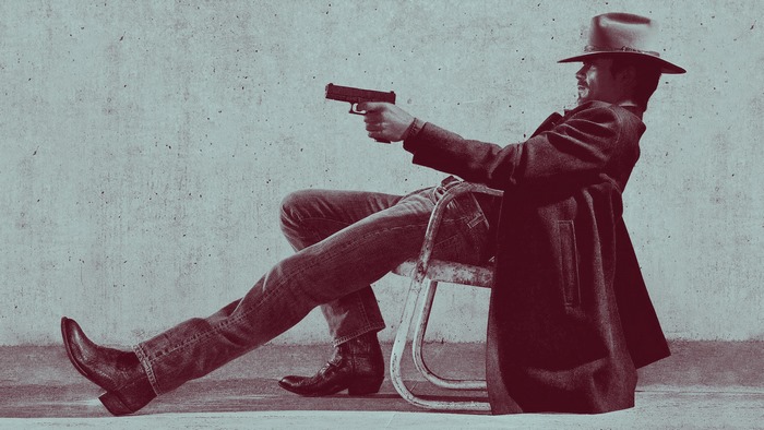 Timothy Olyphant as a cowboy holding a gun