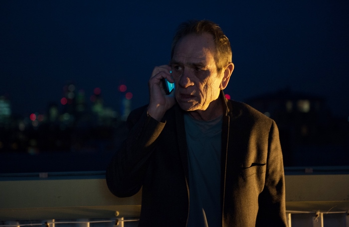 Tommy Lee Jones on phone at night