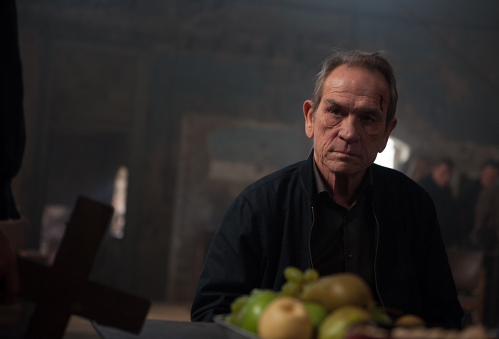 Tommy Lee Jones in a dimly lit room