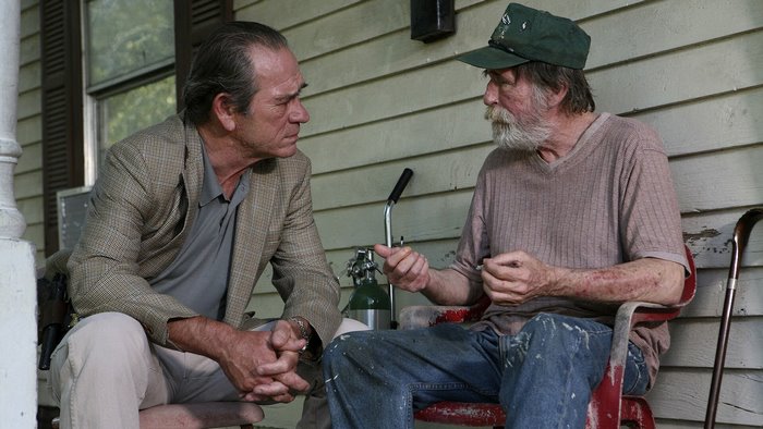 Tommy Lee Jones and an older man on a porch