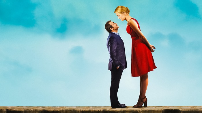 Jean Dujardin and woman in red dress