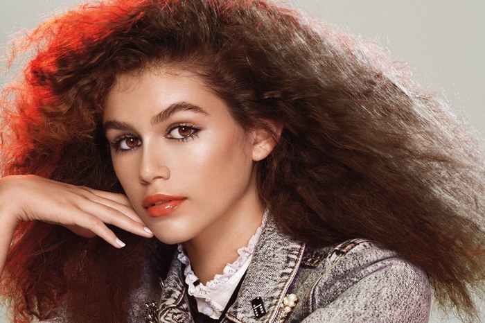 Kaia Gerber with voluminous hair and denim jacket