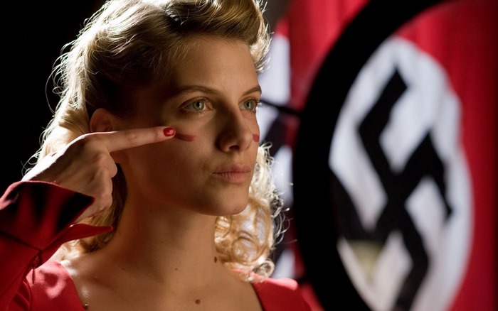 Mélanie Laurent in front of a Nazi flag