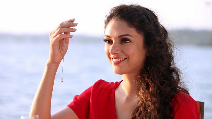 Aditi Rao Hydari holding a necklace