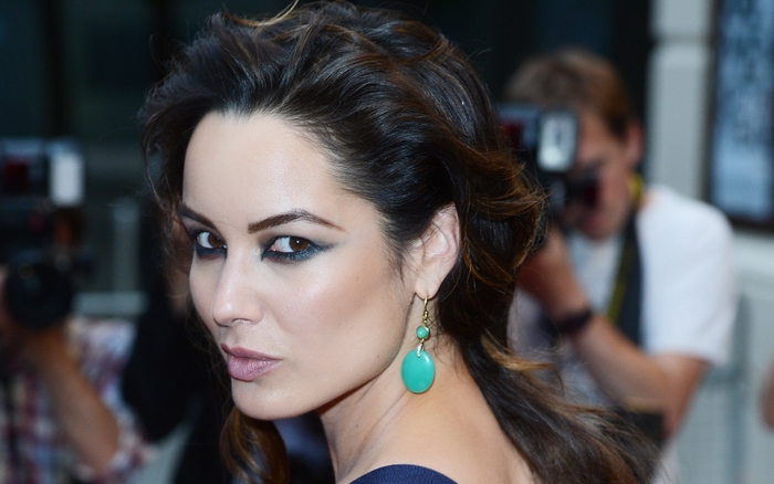 Bérénice Marlohe with turquoise earrings