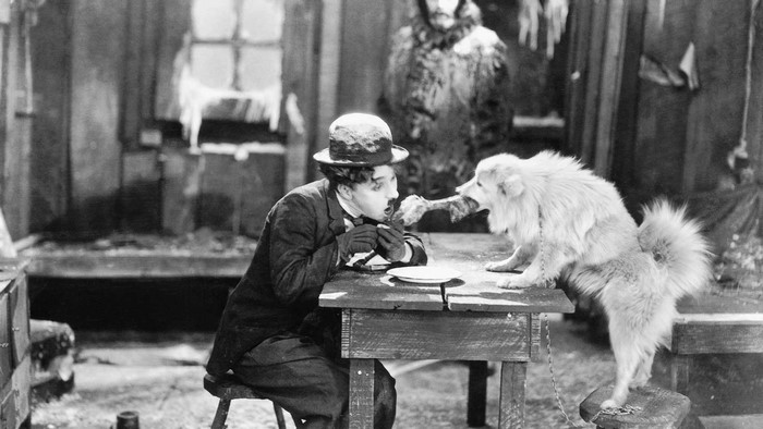 Charlie Chaplin and a dog