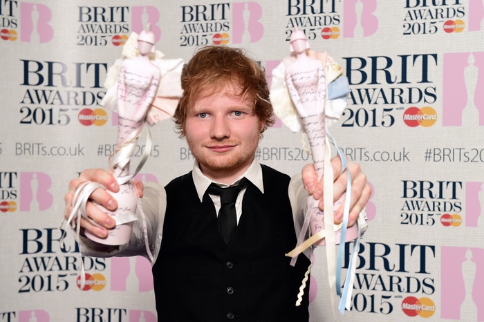 Ed Sheeran holding Brit Awards 2015 trophies