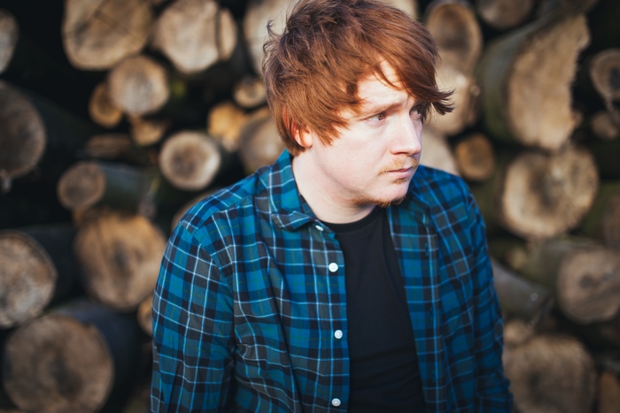 Ed Sheeran in a plaid shirt