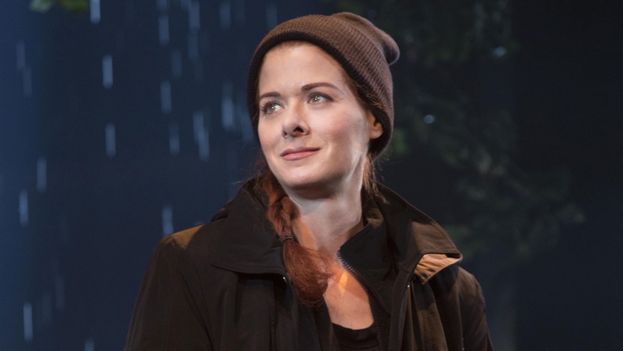 Debra Messing in a beanie and jacket