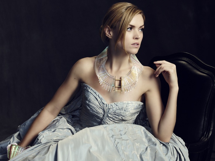 Woman wearing a statement necklace and gown