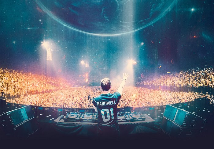 Hardwell performing on stage with a large crowd