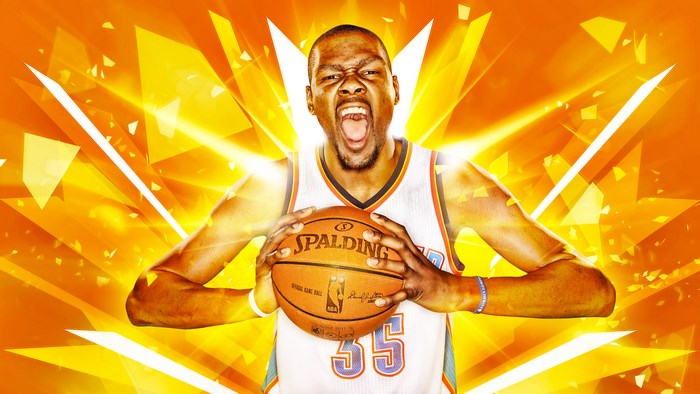 Kevin Durant holding a Spalding basketball