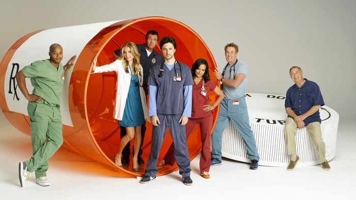 Scrubs cast with giant prescription bottle