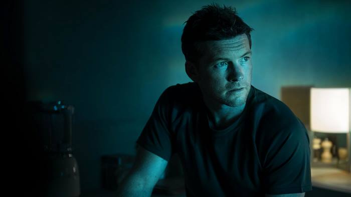 Sam Worthington in dark room