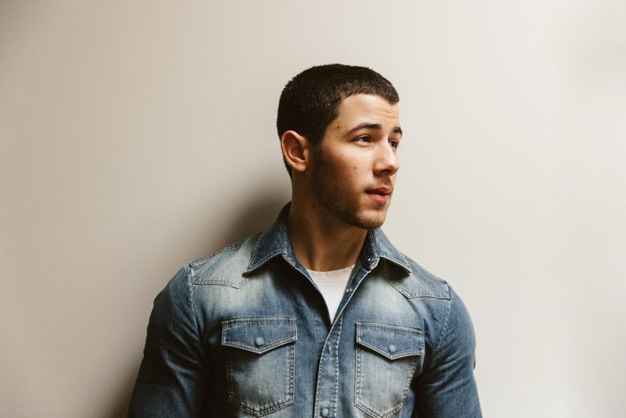Nick Jonas wearing a denim shirt