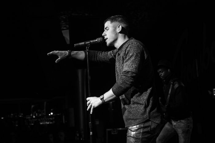 Nick Jonas performing on stage