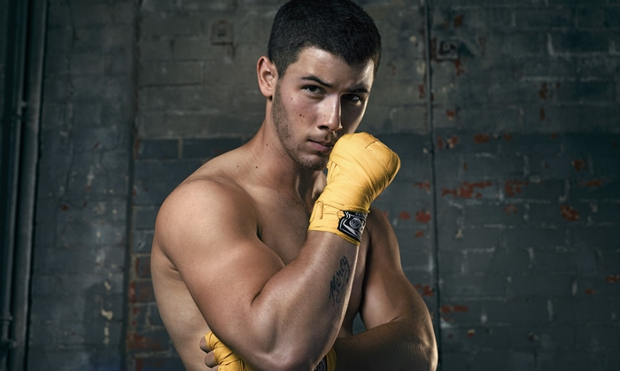 Nick Jonas wearing boxing hand wraps
