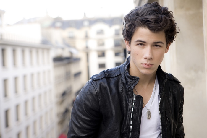 Nick Jonas in a black leather jacket