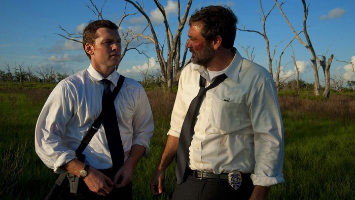 Sam Worthington in a field