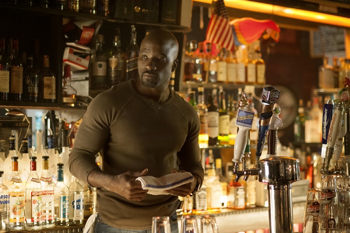 Mike Colter in a bar