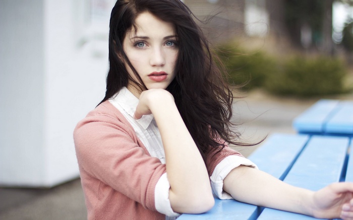 Young woman with dark hair and blue eyes
