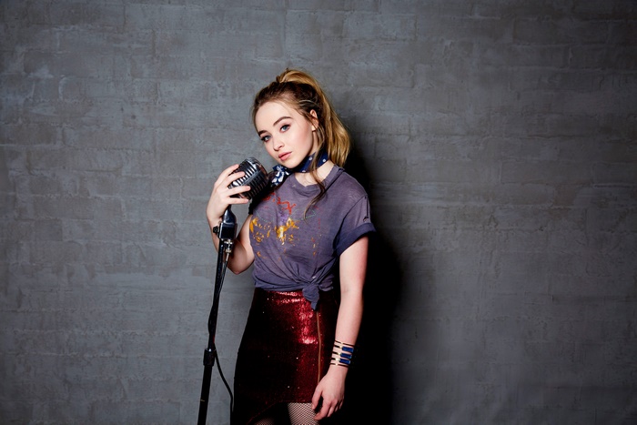Sabrina Carpenter with microphone