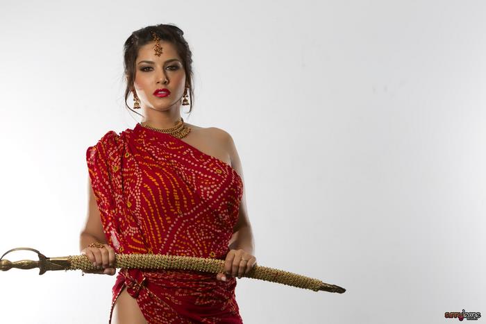Sunny Leone in Red Traditional Attire Holding Sword