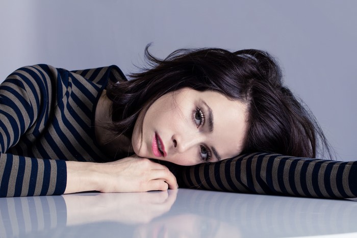 Abigail Spencer lying on a table