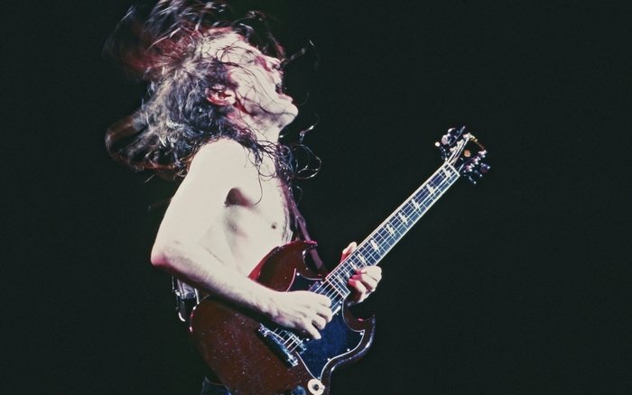 Angus Young playing guitar