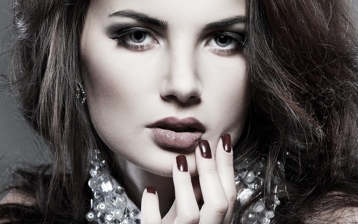 Woman with dark hair and makeup