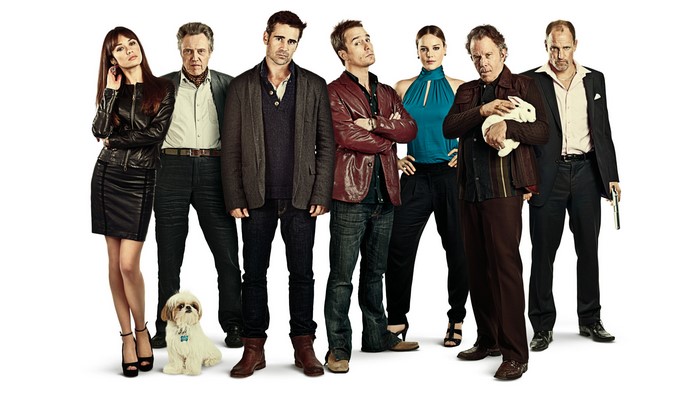 Seven people and a dog posing