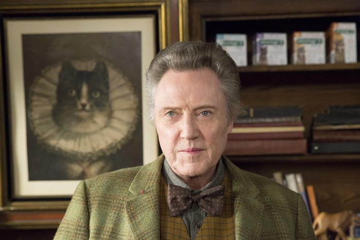 Christopher Walken in a study with a cat portrait