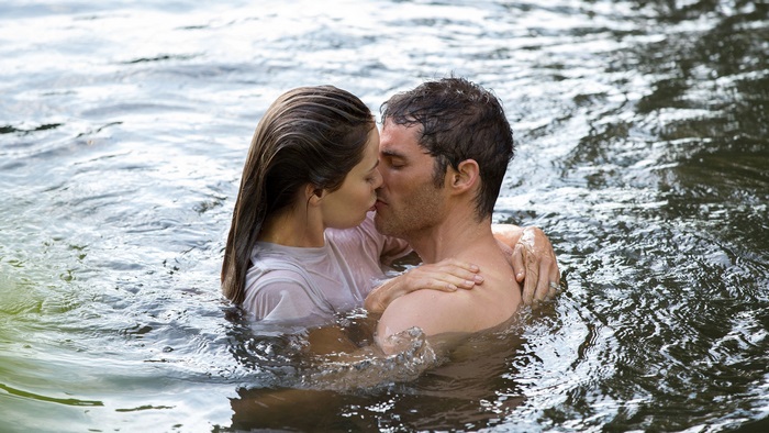 James Marsden kissing a woman in water