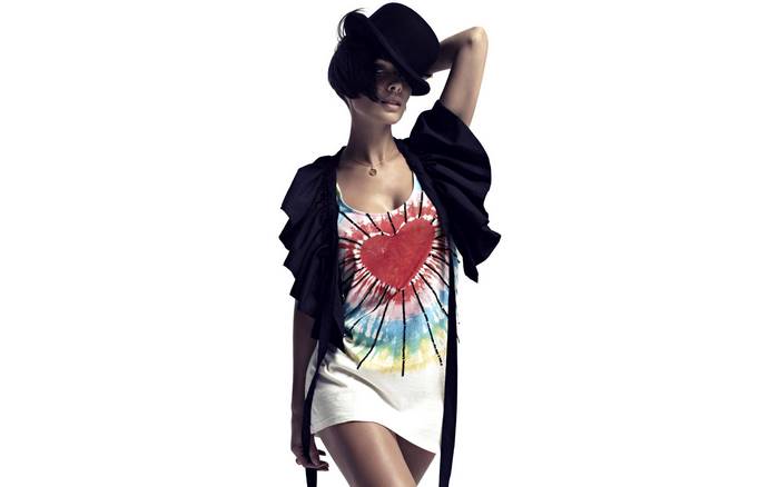 Natalie Imbruglia wearing a hat and a heart t-shirt