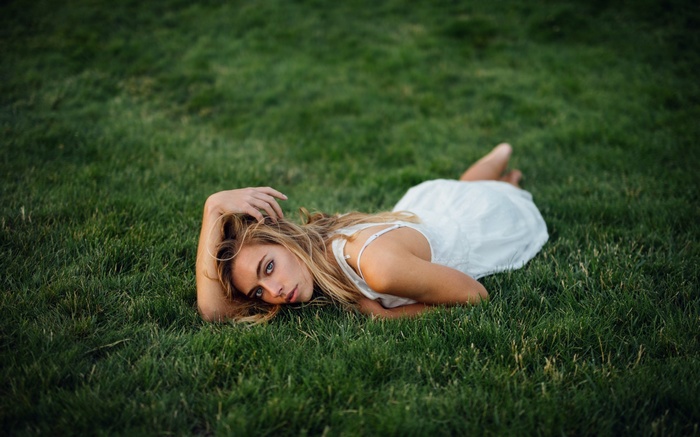 Woman lying on grass