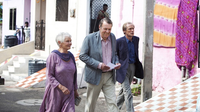 Judi Dench and two men in India