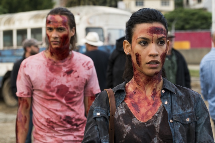 Nick Clark and woman covered in blood